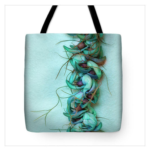 https://fineartamerica.com/featured/blue-jade-lei-with-hinahina-jade-moon.html?product=tote-bag